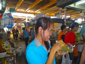 Waida, one of our chefs, explaining the food and spices at the Phuket Town Market. 
