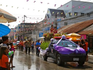 Parade participants also get doused with water. 