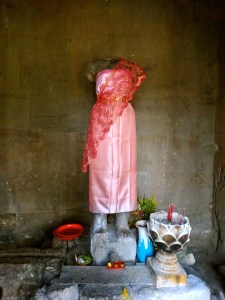 Beheaded statue reminiscent of the days of war. 